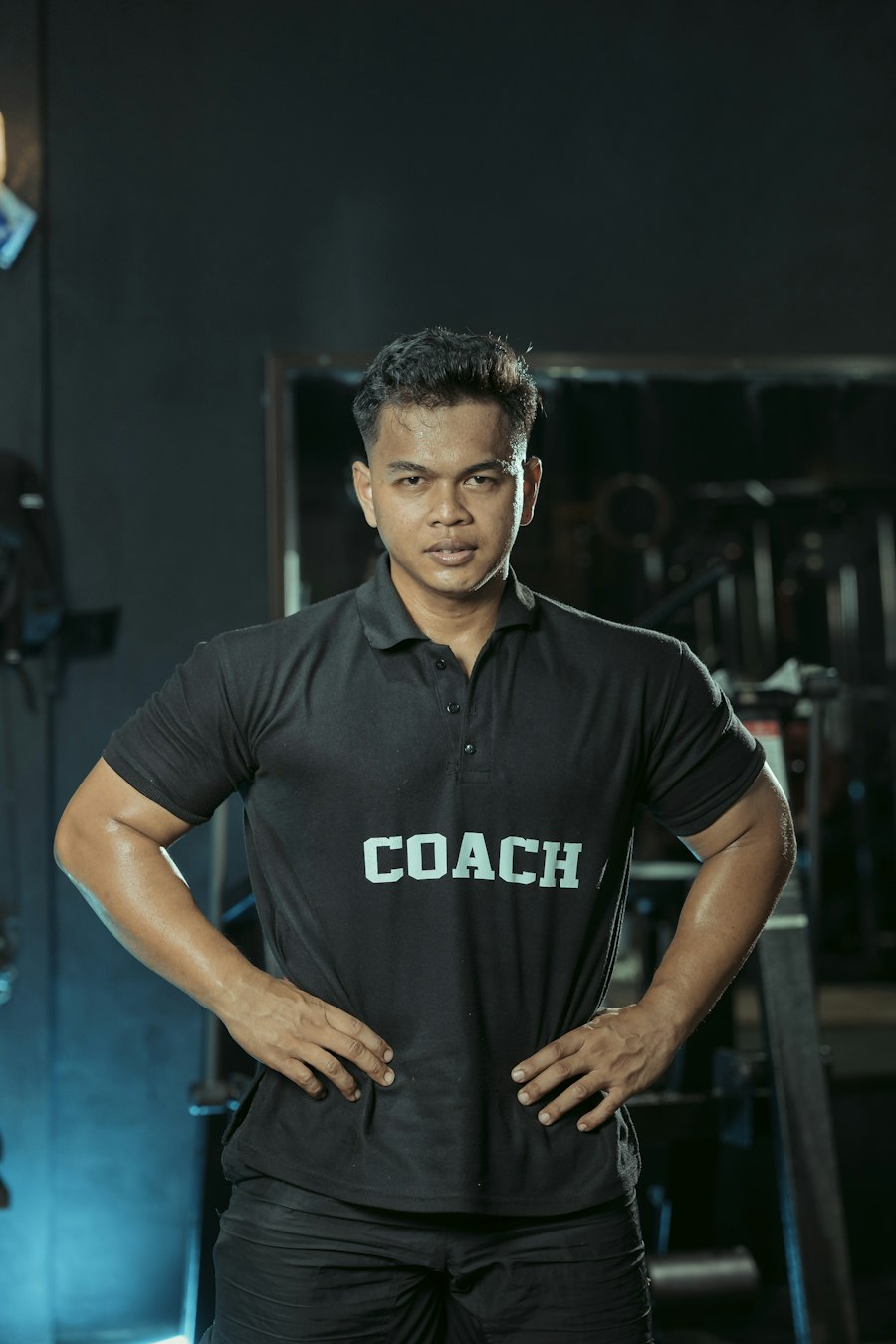 Coach wearing Refined Hybrid Training gear in the gym