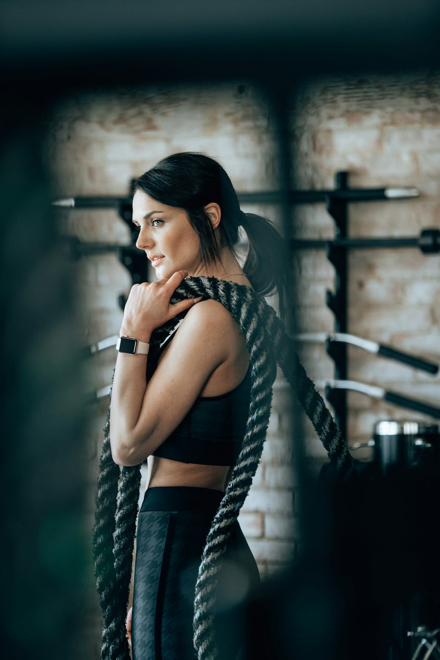 Coach with battle ropes in the training space